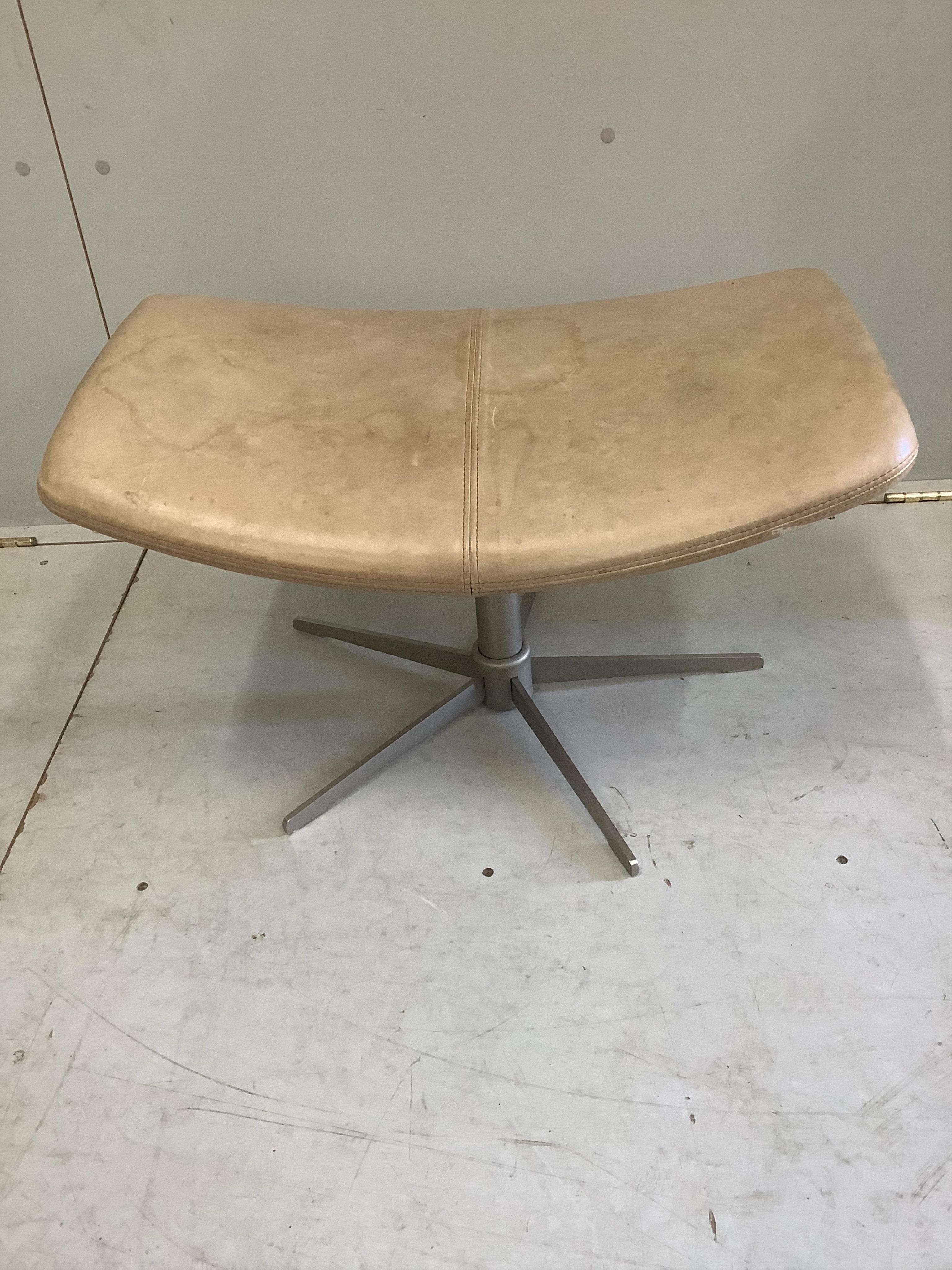 A Bo Concept Imola natural leather swivel chair, width 93cm, depth 90cm, height 110cm and footstool